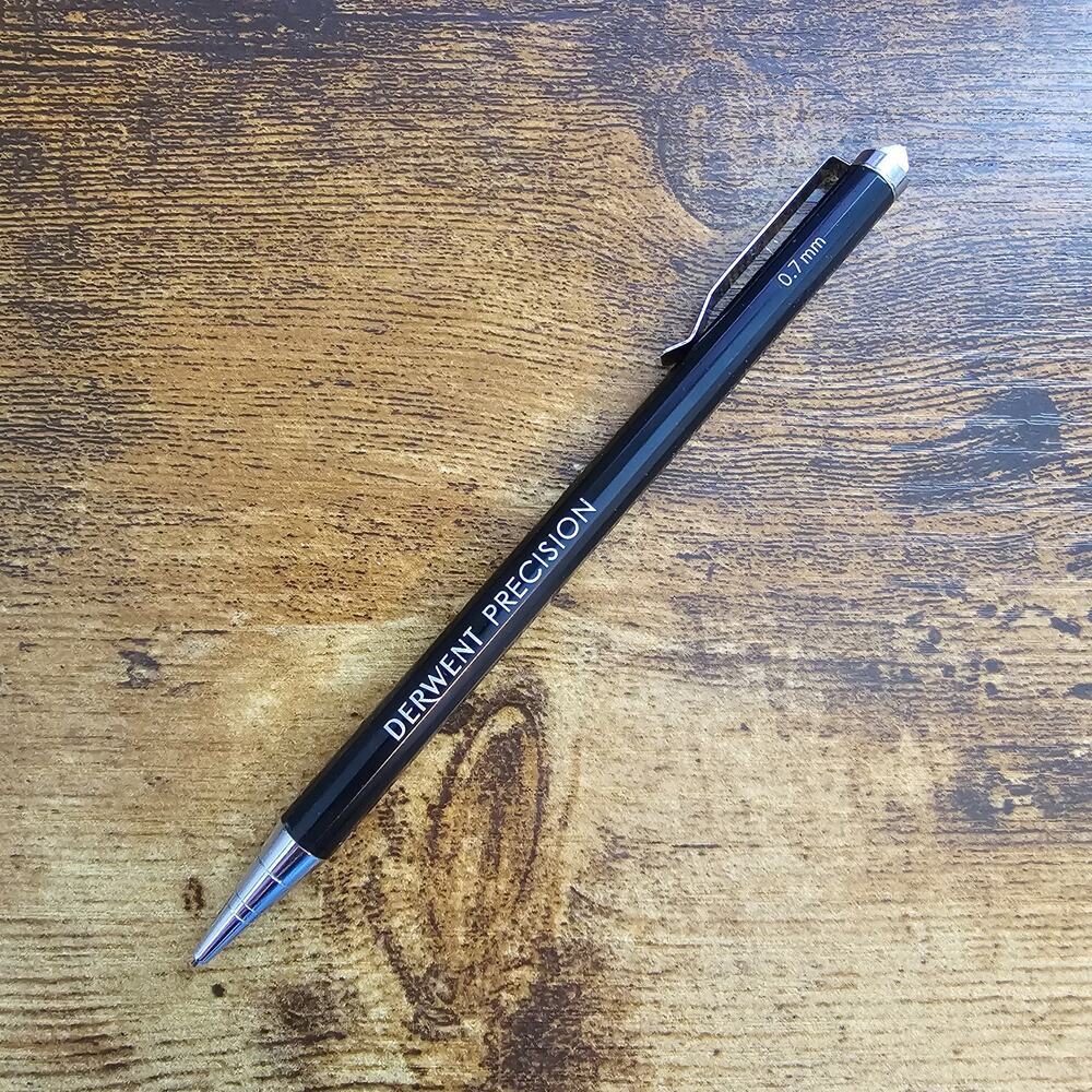 Derwent Precision mechanical pencil with a black metal barrel and 0.7mm lead